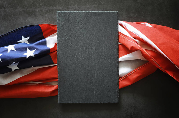 American flag on a black stone background. Space for text. - Photo, Image