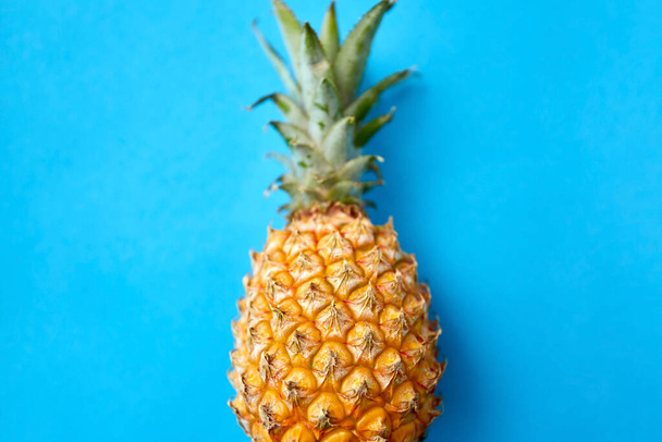 close up of pineapple on blue background - Φωτογραφία, εικόνα