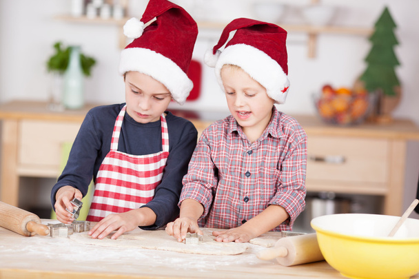 Two cute boys preparing Christmas cookies - Zdjęcie, obraz