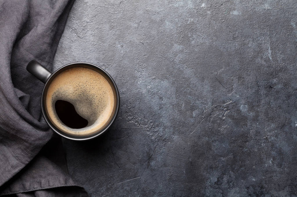 Coffee cup on dark stone table. Top view with copy space. Flat lay - Foto, Imagem