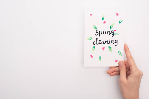 cropped view of woman holding spring cleaning card on white background - 写真・画像
