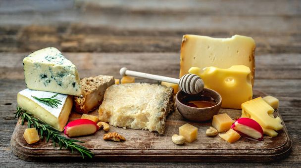 Appetizing cheese plate - Фото, зображення
