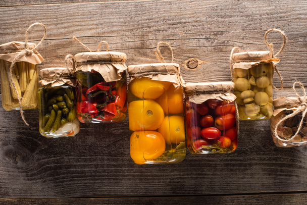 top view of delicious homemade tasty pickles on wooden rustic table - Fotoğraf, Görsel