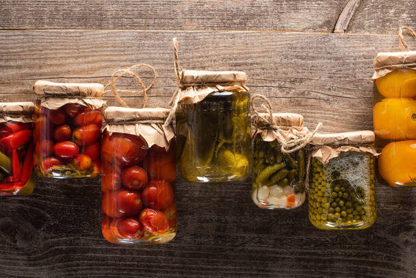 top view of delicious homemade tasty pickles on wooden rustic table - Fotografie, Obrázek