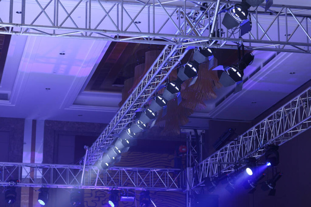 Performance moving lighting on construction light beam ray downward in yellow blue color, on Concert and Fashion Show stage ramp - Photo, Image