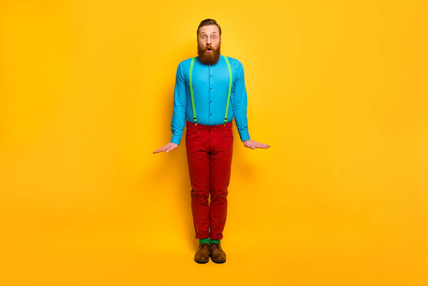 Full length body size view of his he nice attractive bearded funky amazed guy posing fooling isolated over bright vivid shine vibrant yellow color background - Foto, afbeelding