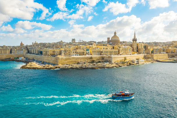 Aerial view of  Valletta city - capital of Malta country. Tourist boat in Mediterranean sea - Photo, Image