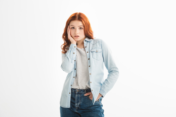 beautiful thoughtful redhead teen girl in denim clothes, isolated on white - Fotografie, Obrázek