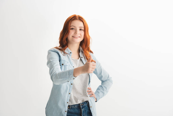 smiling redhead female teenager showing thumb up, isolated on white - Photo, Image