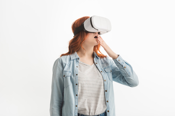 shocked teenager gesturing and using vr headset, isolated on white - Foto, Bild