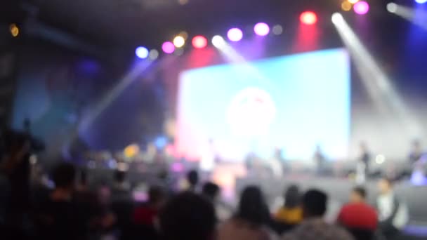 Blurred background large screen stage many people multicolored - Footage, Video