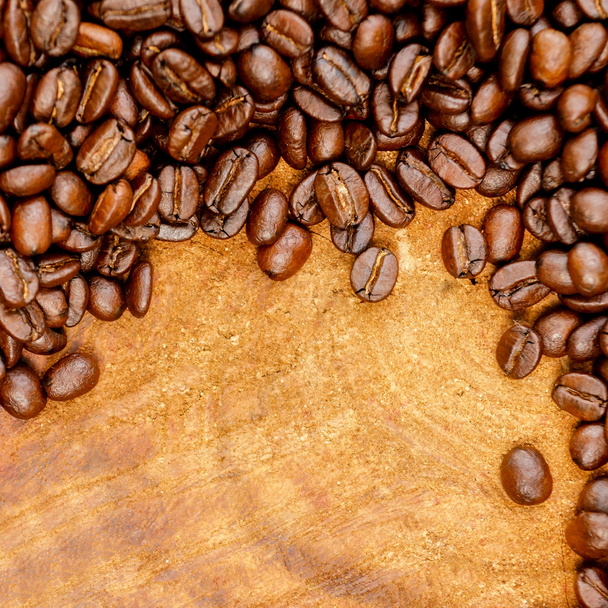 Coffee bean on wood background - Фото, изображение