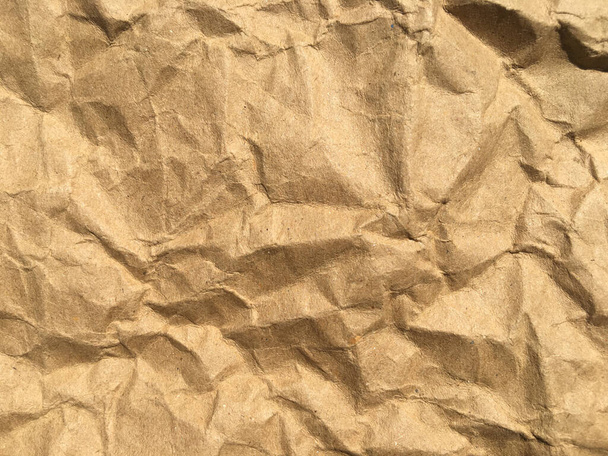 Καφέ ρυτίδων ανακυκλώνουν φόντο χαρτί για το σχεδιασμό. Κενή επιφάνεια για κείμενο ή εργασία - Φωτογραφία, εικόνα