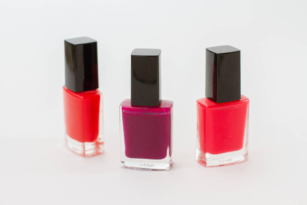 a group of bright nail polishes on white - Photo, Image