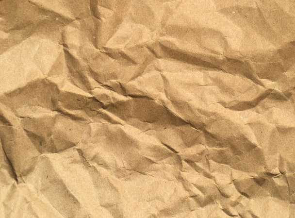 Καφέ ρυτίδων ανακυκλώνουν φόντο χαρτί για το σχεδιασμό. Κενή επιφάνεια για κείμενο ή εργασία - Φωτογραφία, εικόνα