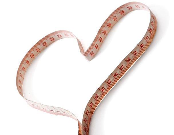 A measuring tape shaping a heart - Foto, afbeelding