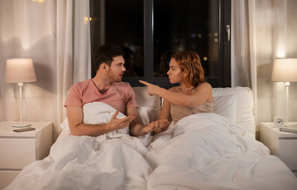 unhappy couple having conflict in bed at home - Foto, Imagem