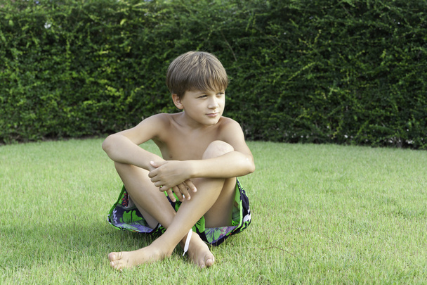 Boy on the grass - Foto, afbeelding