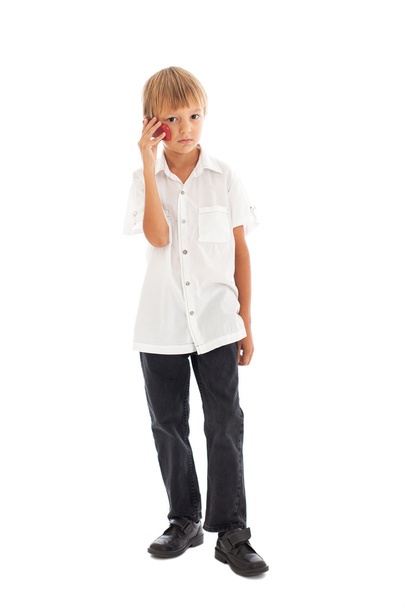 Boy holding a mobile phone - Fotó, kép