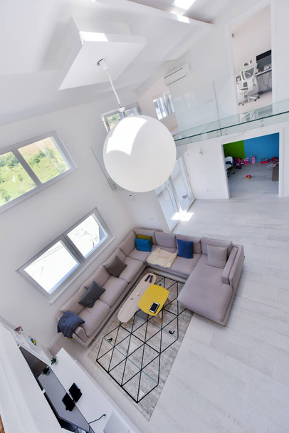 interior of a luxury stylish modern open space design two level apartment with white walls - 写真・画像