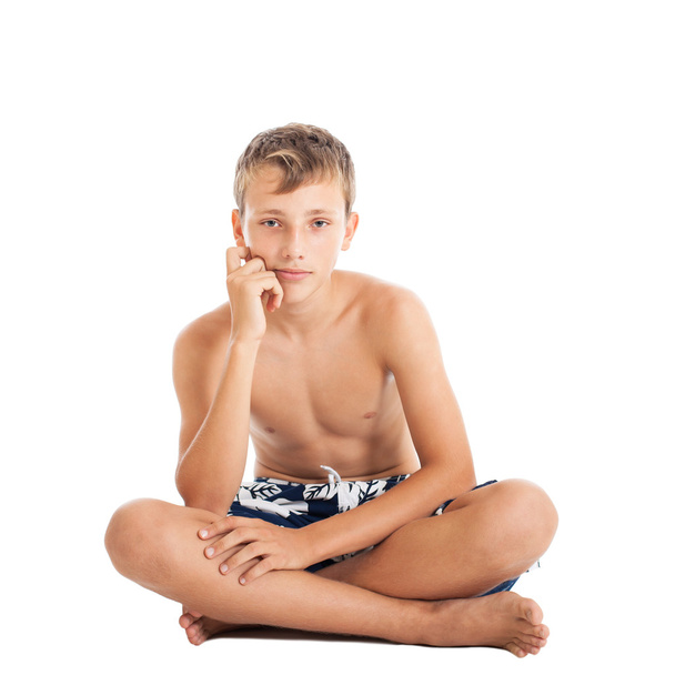 Boy wearing swimming shorts - Фото, изображение
