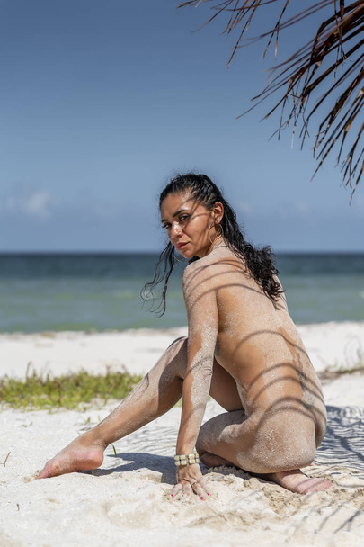 A gorgeous Hispanic Brunette model poses nude on a Mexican beach - Fotoğraf, Görsel