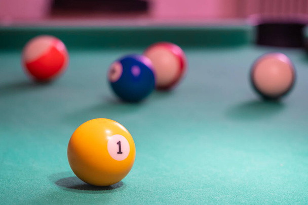 Billiard balls on table. Leisure and gambling concept. Toned image of striped colorful balls - Photo, Image