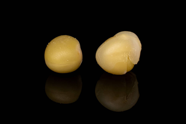 Group of two whole canned pea isolated on black glass - Fotografie, Obrázek