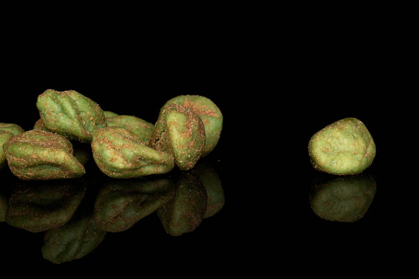 Group of six whole wasabi green peanut isolated on black glass - Foto, afbeelding