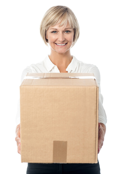 Woman holding cardboard box - 写真・画像