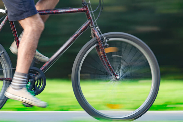 Riding bicycle - blurred motion, fast driving. - Photo, Image