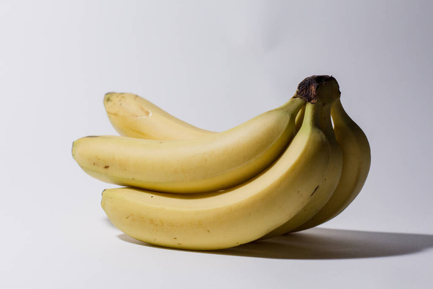 ripe bananas on a white background - Foto, afbeelding