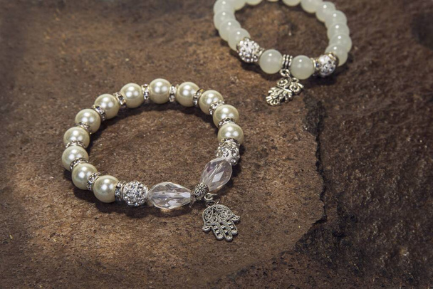Pearl bracelet custom jewelry on the wood or stone background - Photo, Image