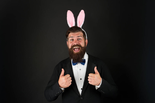 Easter day. Event host. Celebrate Easter. Let me be your bunny. Celebration Easter holiday. Bearded man with long ears. Businessman with long ears. Handsome man wear bunny costume accessory - Photo, image