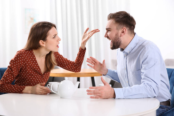 Couple having quarrel in cafe. Relationship problems - 写真・画像