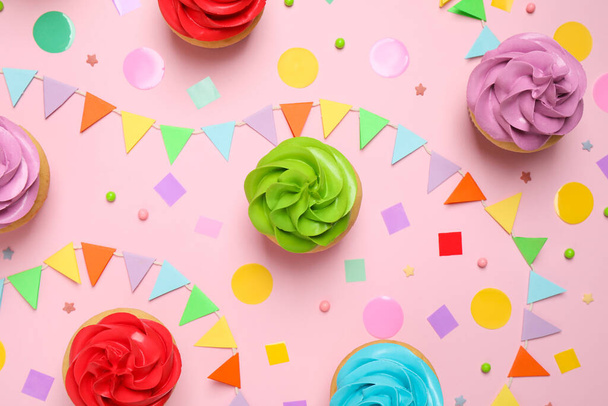 Colorful birthday cupcakes on light pink background, flat lay - Foto, Imagem