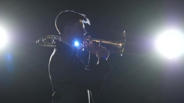 Silhouette Man Standing And Trumpet Melody., People Stock Footage