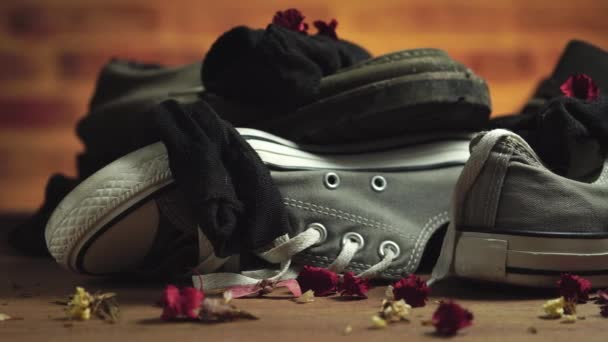 Dirty sneaker and socks stacked on the floor. Concept of travel. - Footage, Video