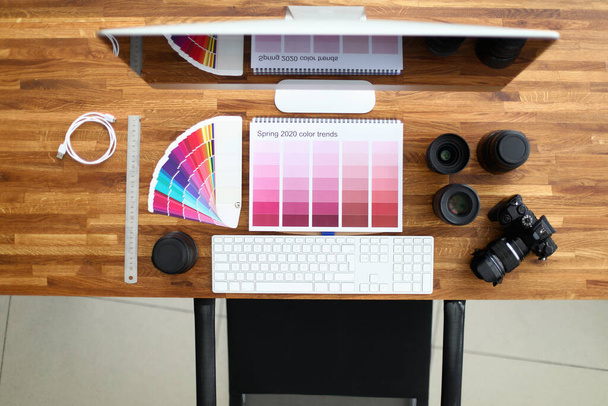 Photographers desk, camera and color palette - Photo, Image