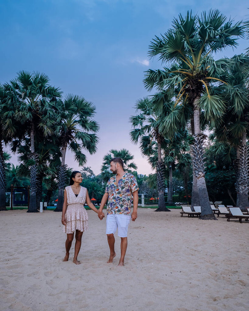 NaJomtien Pattaya Thailand, couple men and woman walking on the beach during sunrise in Pattaya Thailand - Photo, Image