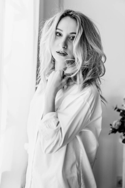 a beautiful blonde girl in white shirt  - Fotó, kép