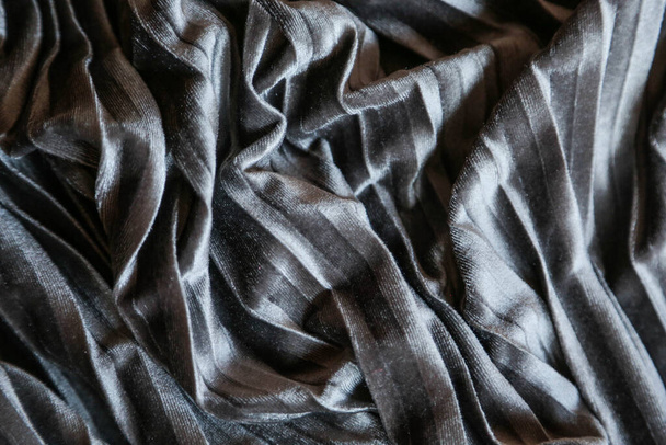  Grey plush velvet background. Close up gray fabric texture background. wrinkled and shadows, selective focus top view - 写真・画像