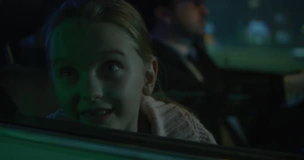 Girl pushing face against car window - Footage, Video