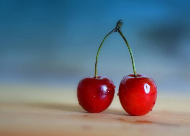 Freshly picked fresh cherry from the branch - Foto, afbeelding