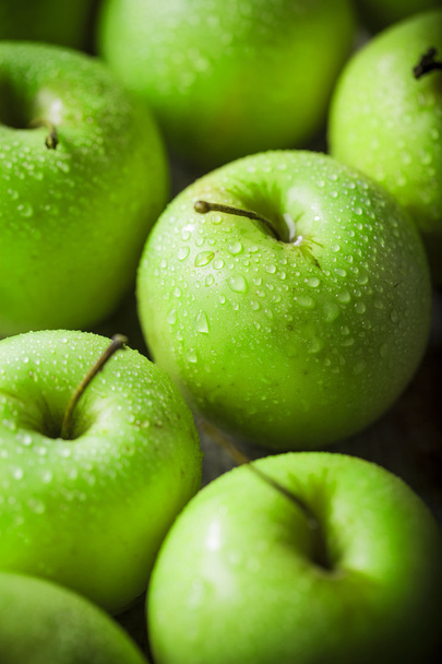 Fresh healthy green apples on wooden background - 写真・画像