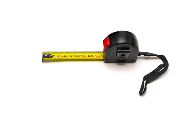 yellow measuring tape in a black case on a white background - Photo, Image