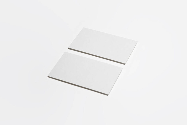 Two vertical Business Cards Mock-up at the white textured paper background.High-resolution photo.Top view - Photo, Image