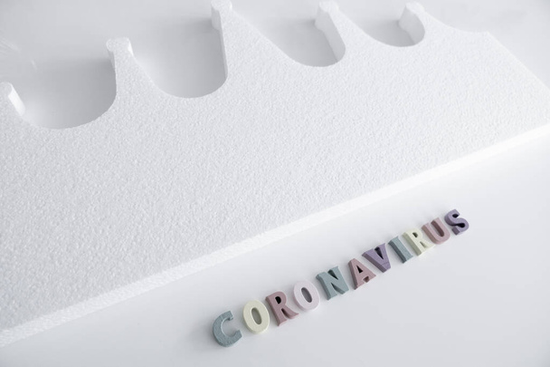 Coronavirus Colorful Game Letters on a White Background and a Crown - Fotografie, Obrázek