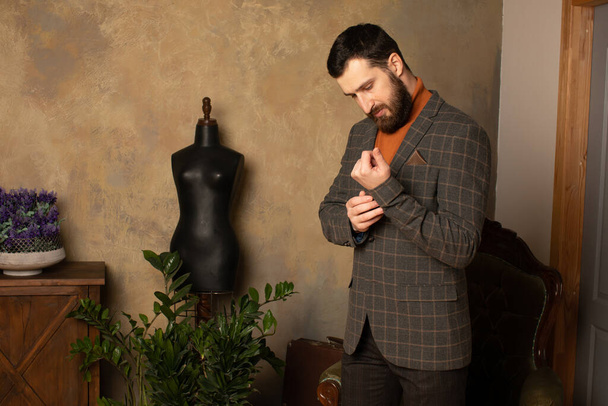 Respectable young bearded man in a room with classic interior. Luxury. Men's beauty, fashion. - Foto, immagini