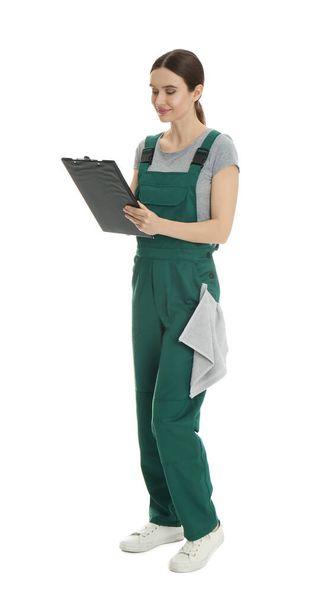 Full length portrait of professional auto mechanic with clipboard and rag on white background - Φωτογραφία, εικόνα